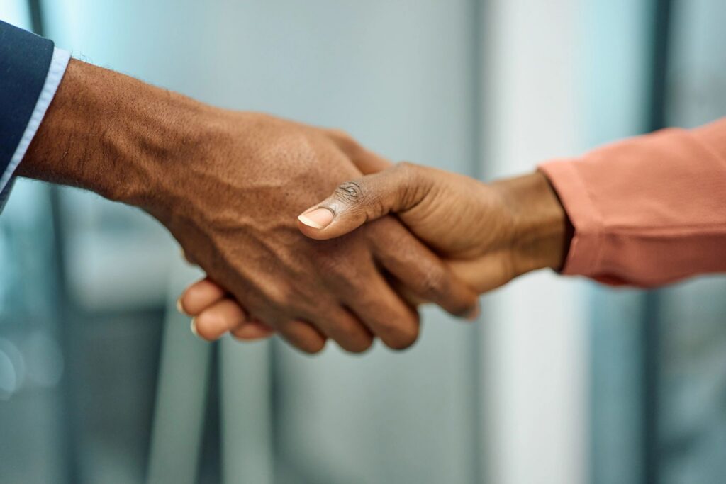 Business partners shaking hands making an agreement